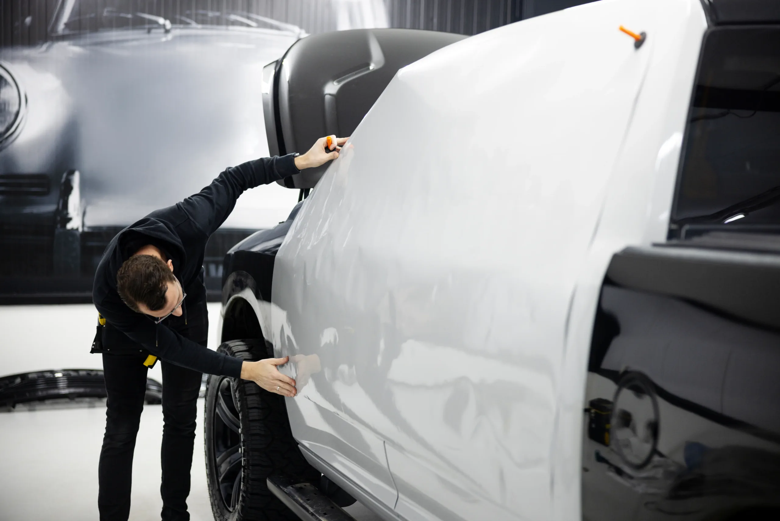 full-shot-man-wrapping-car